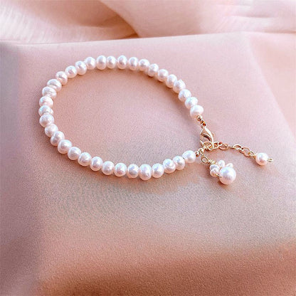 Nueva pulsera de pata de gato con perlas de agua dulce para mujer, bonita y moderna.