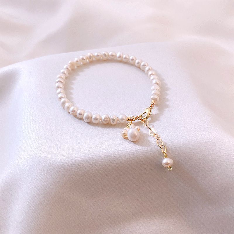 Nueva pulsera de pata de gato con perlas de agua dulce para mujer, bonita y moderna.